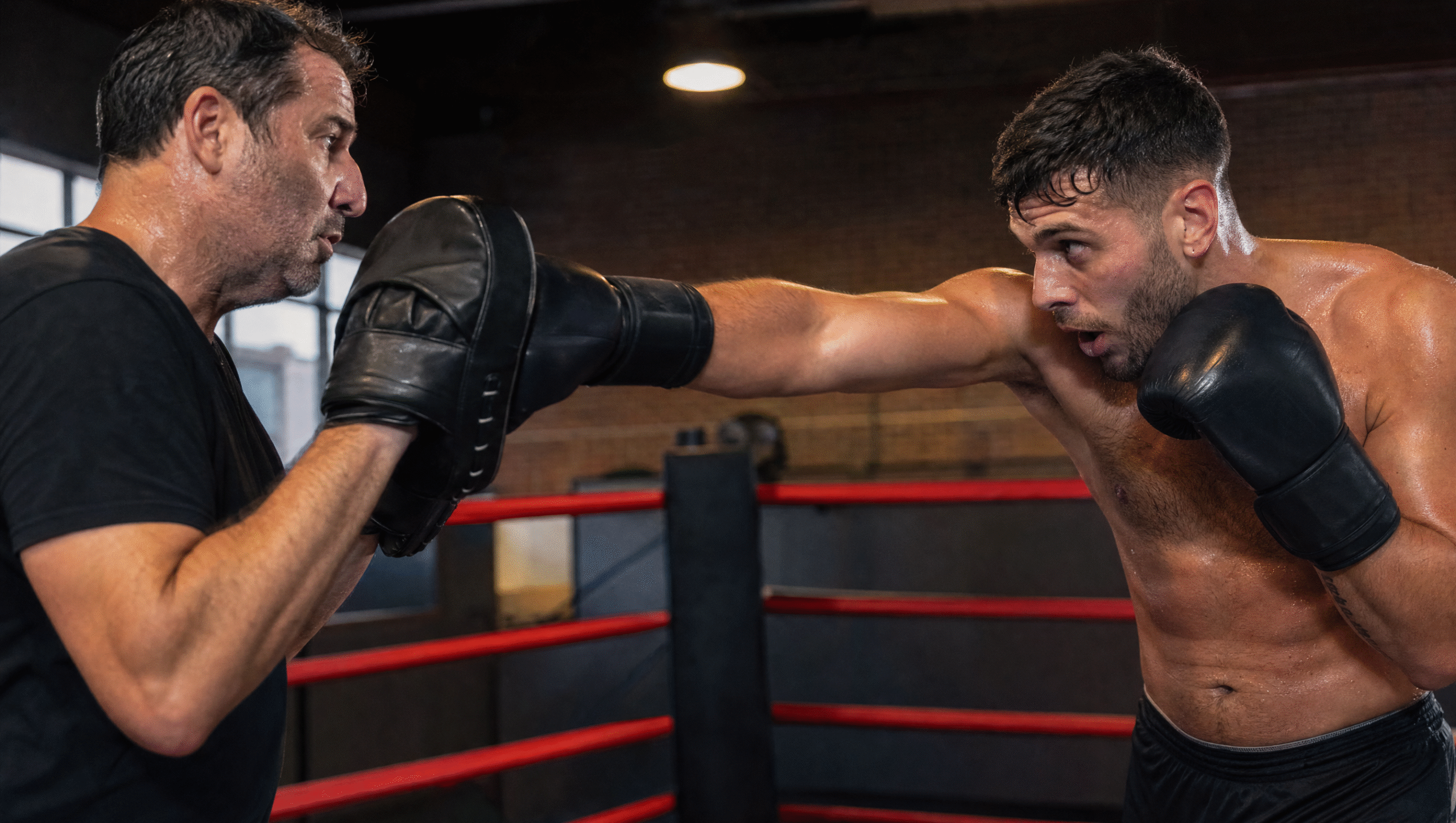 boxing club White Rock coach holding pads