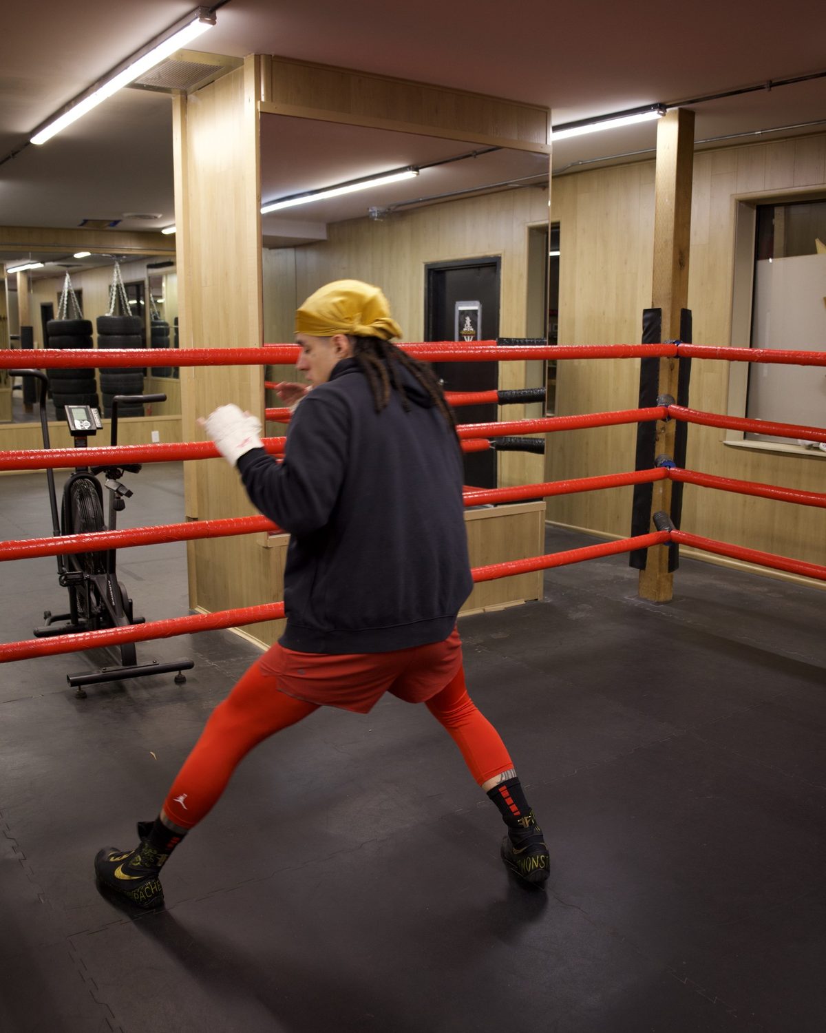 A boxer shadowboxing in the ring, working on stance and footwork, boxing classes surrey at Kingdom Athletics
