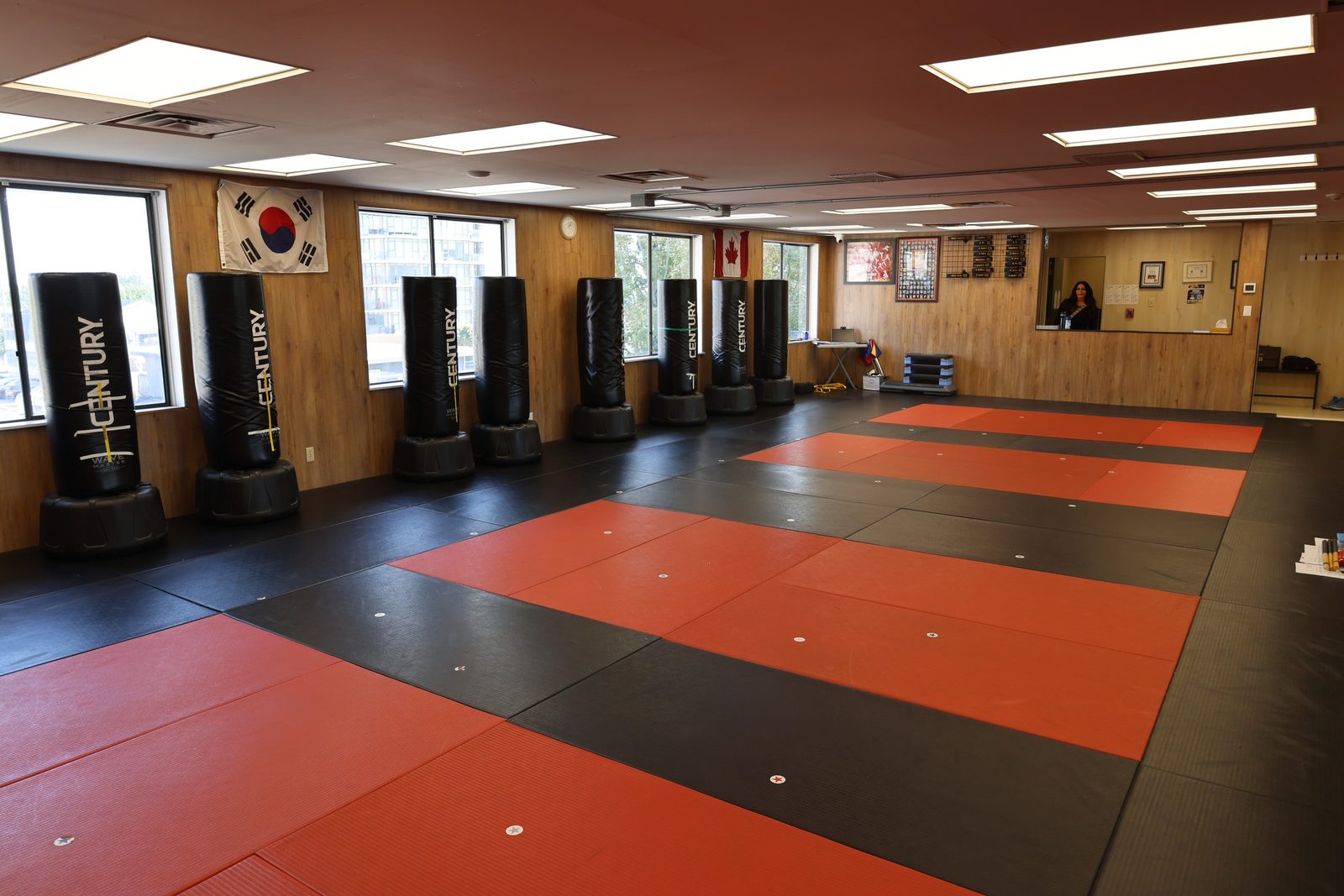 The martial arts room with mats and standing bags at Kingdom Athletics
