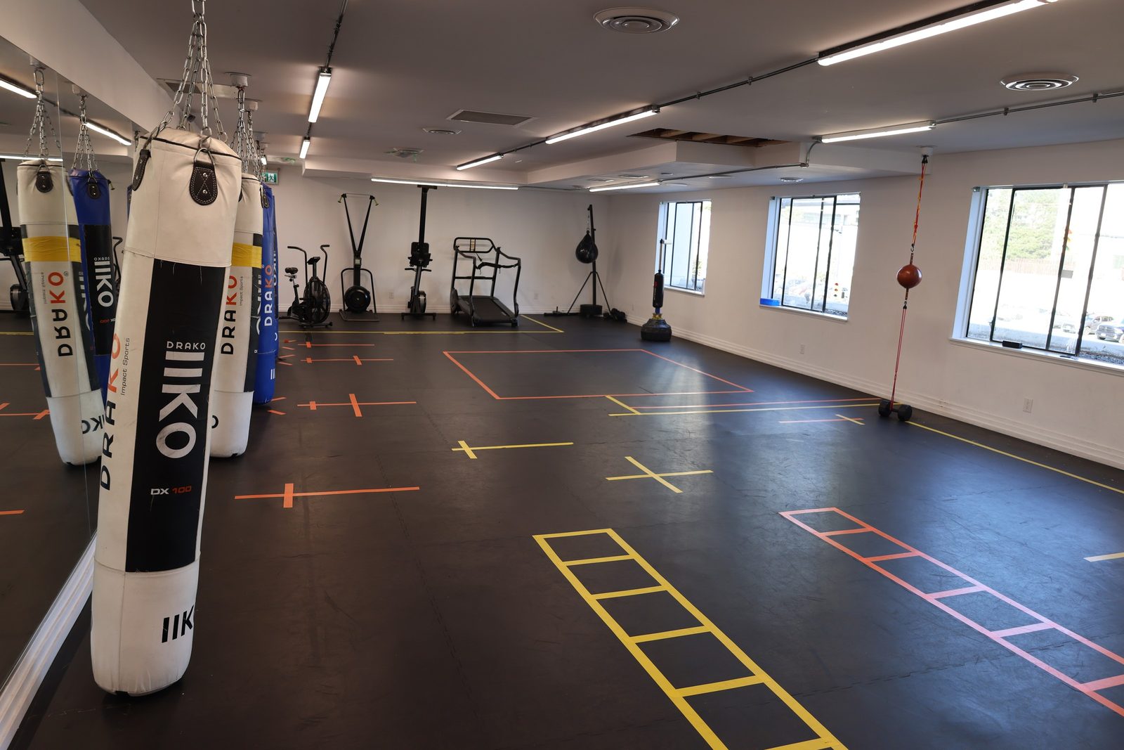 The heavy bag floor where kids boxing classes train at Kingdom Athletics